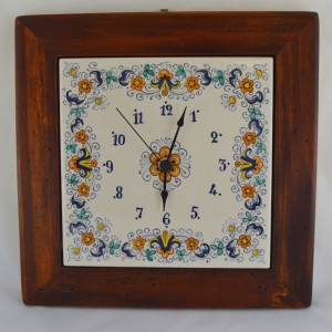 CLOCK &ldquo;VOLUTE FIORI&rdquo; WITH WOODEN FRAM WORM-EATEN FROM CM. 28,5