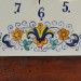 OROLOGIO “VOLUTE FIORI” CON CORNICE TARLATA  DA CM. 28,5